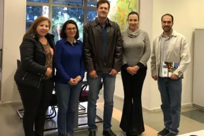 equipe participa de reunião para conhecer nova lei de emissão de alvarás